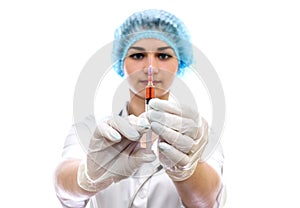 Beautiful nurse with syringe isolated on white