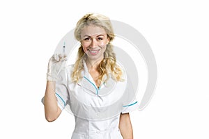 Beautiful nurse with syringe, white background.