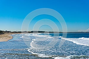 Beautiful ocean beach with blue sky