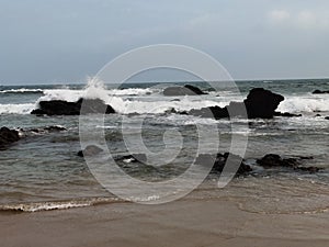 Beautiful ocean and his waves of white water touche the sea shore.