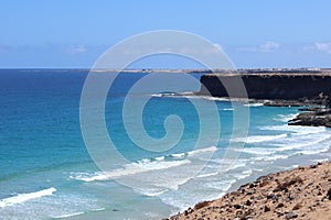 Beautiful ocean landscape with cliffs and clear waters and sky