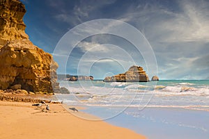 beautiful ocean shore with clean yellow sand at sunset with a picturesque sky