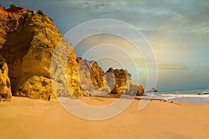 beautiful ocean shore with clean yellow sand at sunset with a picturesque sky