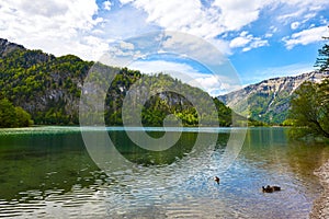 Beautiful Offensee lake landscape with mountains, forest, clouds and resting-place in Austrian Alps. Salzkammergut region