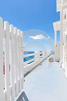 Beautiful Oia town on Santorini island, Greece. White entrance and stairs with sea view, wonderful scenery, vertical travel