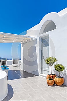 Beautiful Oia town on Santorini island, Greece. Wonderful scenery of white resort or hotel architecture