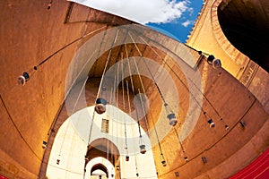 Beautiful oil lamps hanging from the vault of southwest iwan of Madrasa and Friday Mosque of Sultan Hassan in Cairo