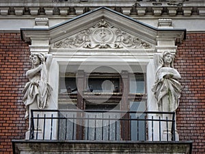 Beautiful old balcony with statues of tenant building in Katowice, Poland.