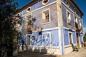 Beautiful old building in blue color in Polop, Spain
