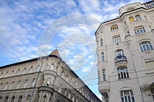 Beautiful old building and street view of historic architectural under blue sunny sky in Budapest, Hungary.