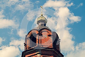 Beautiful old church tower with the cross