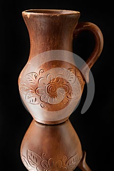 Beautiful old clay jug with patterns