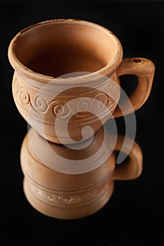 Beautiful old cup made of clay with patterns