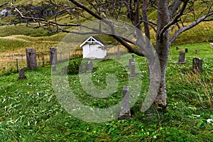 Beautiful old graveyard at the village Vinstad on Lofoten Islands in Norway.