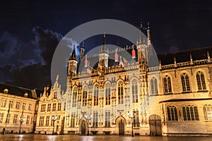 Beautiful old house on the Market Square in Bruges at night.