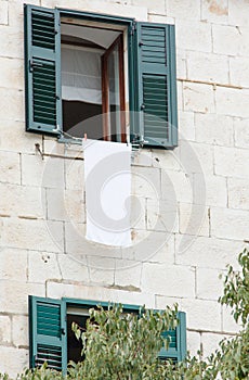 Beautiful old house from a white brick, open window