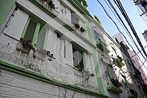 Beautiful old japanese building with green windows in Osaka photo