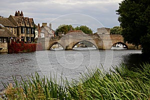 Beautiful old medieval bridge over the Great Ouse with the ancient Bridge chapel from Hemingford Grey water meadow.