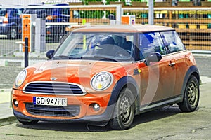 Beautiful old Morris Mini Cooper orange parked