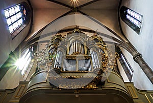 Beautiful old organ decorated by gold