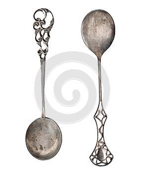 Beautiful old silver spoons isolated on white. Retro silverware