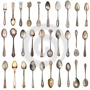 Beautiful old silver spoons isolated on white. Retro silverware