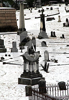 Beautiful old tombstones scattered over hilly terrain of cemetery