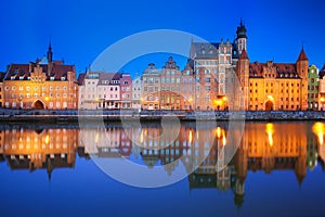 Beautiful old town of Gdansk reflected in Motlawa river at dawn, Poland