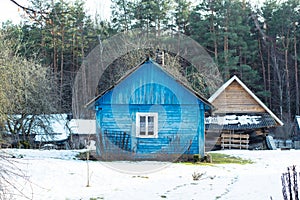 Beautiful old traditional wooden blue house in the village