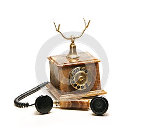 A beautiful old vintage brown telephone on white