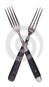 Beautiful old vintage crossed forks isolated on white background. Top view. Retro silverware