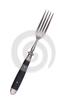 Beautiful old vintage fork isolated on white background. Top view. Retro silverware