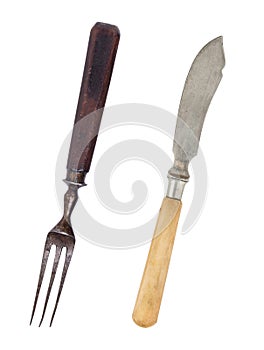 Beautiful old vintage fork and knife isolated on white background. Top view. Retro silverware