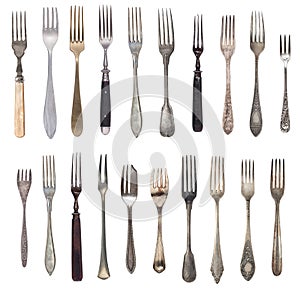 Beautiful old vintage forks isolated on white background. Top view. Retro silverware