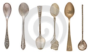 Beautiful old vintage teaspoons isolated on white background. Top view. Retro silverware