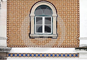 Beautiful old window on tiled wall in Portugal