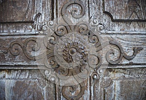 Beautiful old wooden door detail at the pilgrimage Church Maria Strassengel, a 14th century Gothic church in the town of Judendorf