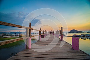 Beautiful old wooden pier, bridge over sea for fishing and walking photo