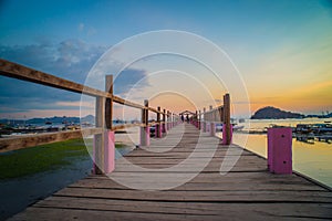 Beautiful old wooden pier, bridge over sea for fishing and walking photo