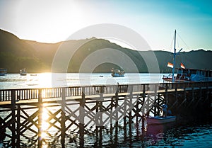 Beautiful old wooden pier, bridge over sea for fishing and walking photo