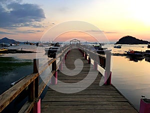 Beautiful old wooden pier, bridge over sea for fishing and walking photo