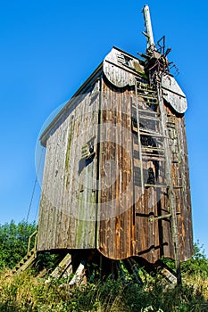 Beautiful old wooden windmill and blue sky, Poland