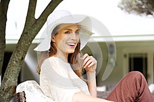 Beautiful older woman smiling with sun hat