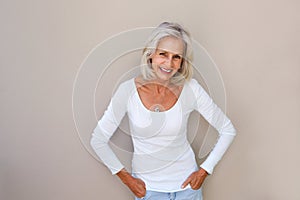 Beautiful older woman standing and smiling