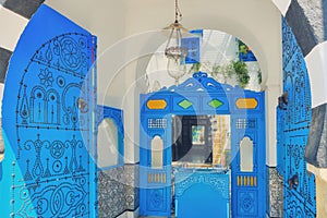 Beautiful open blue door with arabic ornaments, Sidi Bou Said, Tunisia, Africa. June 18 2019