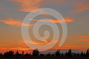 Beautiful orange bright sunset with blue sky and wonderful cloud