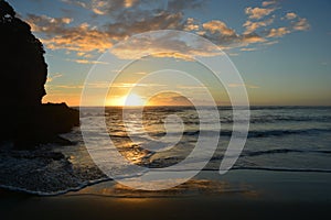 Sunset at piha beach in New Zealand