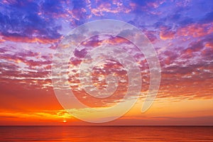 Beautiful, orange-pink sunset over the sea. Background image