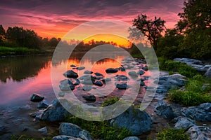 beautiful orange sunrise river landscape with stone around it