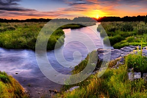 beautiful orange sunrise river landscape with stone around it